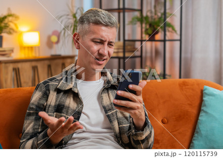 Sad displeased man using smartphone surprised lottery game results, bad news fail, deadline, virus Sad displeased man using smartphone surprised lottery game results, bad news fail, deadline, virus 120115739