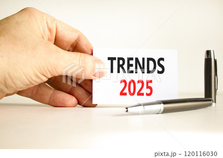 Planning trends 2025 new year symbol. Concept words Trends 2025 on beautiful white card. Beautiful white background. Businessman hand. Business trends 2025 new year concept. Copy space. 120116030