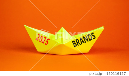 Planning 2025 brands new year symbol. Concept words 2025 Brands on beautiful yellow paper boat. Beautiful orange paper background. Business 2025 brands new year concept. Copy space. 120116127