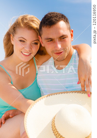 Man and woman sitting together outside Man and woman sitting together outside 120116950