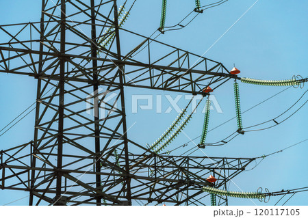 High voltage towers with sky background. Power line support with wires for electricity transmission. High voltage grid tower with wire cable at distribution station. Energy industry, energy saving High voltage towers with sky background. Power line support with wires for electricity transmission. High voltage grid tower with wire cable at distribution station. Energy industry, energy saving 120117105