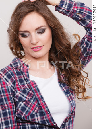 Attractive woman wearing checkered shirt 120117419