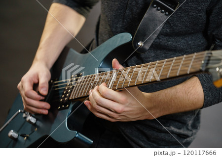 Male hands playing electric guitar Male hands playing electric guitar 120117666