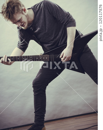 Man playing on electric guitar Man playing on electric guitar 120117876