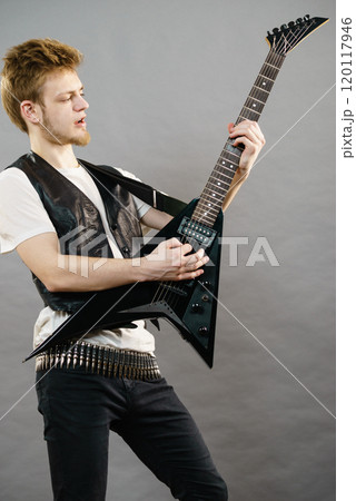 Man playing on electric guitar Man playing on electric guitar 120117946