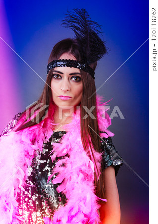 Girl pink plume and black feather on head. Carnival. Girl pink plume and black feather on head. Carnival. 120118262