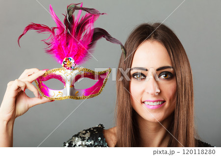 woman holding carnival mask in hand woman holding carnival mask in hand 120118280