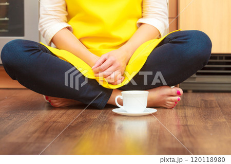 Woman with cup of coffee in kitchen. Woman with cup of coffee in kitchen. 120118980