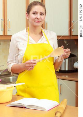 Housewife planning and preparing meal 120119132