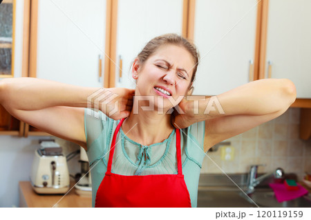 Overworked woman suffering from neck pain. Overworked woman suffering from neck pain. 120119159