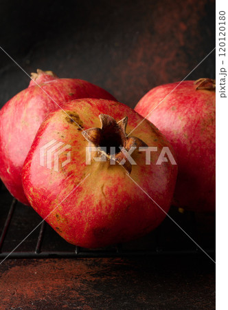 Ripe red pomegranate on brown background 120120180