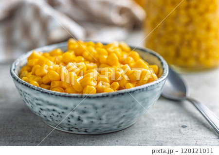 Canned sweet corn in bowl on kitchen table. Canned sweet corn in bowl on kitchen table. 120121011