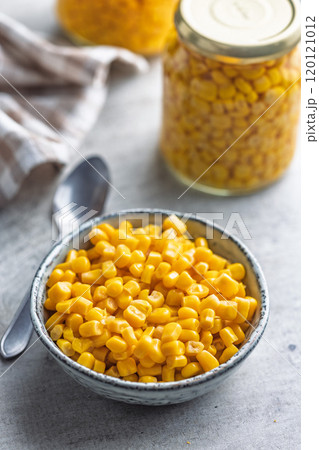 Canned sweet corn in bowl on kitchen table. Canned sweet corn in bowl on kitchen table. 120121012