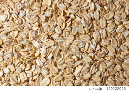 Dry Uncooked Oat Flakes background 120122026