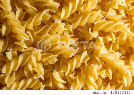 Uncooked Fusilli Pasta Background Uncooked Fusilli Pasta Background 120122513