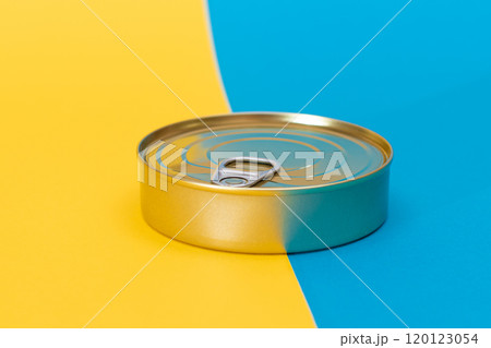 Tin Can on Split Blue and Yellow Background Tin Can on Split Blue and Yellow Background 120123054