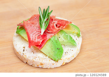 Rice Cake Sandwich with Fresh Avocado, Jamon and Rosemary 120124389