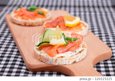 Rice Cake Sandwiches with Fresh Salmon, Cucumber, Lemon and Greens 120125225