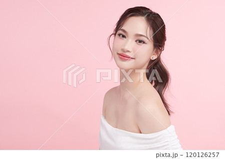 Beautiful young asian woman with clean fresh skin on pink background, Face care, Facial treatment, Cosmetology, beauty and spa, Asian women portrait. Beautiful young asian woman with clean fresh skin on pink background, Face care, Facial treatment, Cosmetology, beauty and spa, Asian women portrait. 120126257
