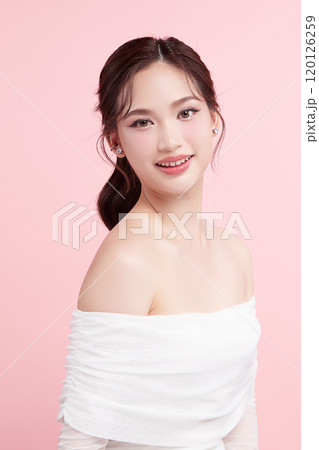 Beautiful young asian woman with clean fresh skin on pink background, Face care, Facial treatment, Cosmetology, beauty and spa, Asian women portrait. 120126259