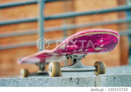 Close-Up of Worn Skateboard at city street 120131720