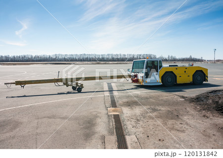Aircraft tow truck with towbar on the airport apron Aircraft tow truck with towbar on the airport apron 120131842