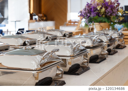 heating trays setup on the buffet line ready for service. breakfast and lunch buffet food catering banquet in hotel. 120134686