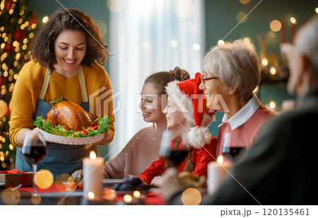 family celebrating Christmas 120135461