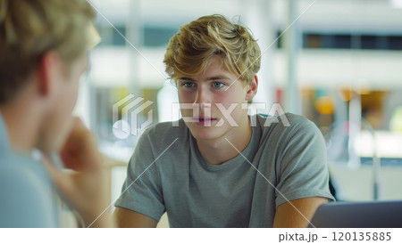 Man in school. Blond young student at classroom. Male teenager in college. Lecture in university. Concept of knowledge or education. Boy studying in highschool class 120135885