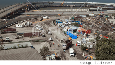 Truck Brought Metal Structures For Construction Of Highway. Aerial View Of Highway Construction Site. People At Work. , , . Construction Of New Highway Is Underway. Construction Of New Road Roundabout 120135967