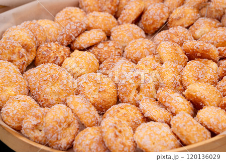 Puff pastries, round sugar-coated sugar puffs, golden crispy baked sweets, traditional French patisserie, biscuits Puff pastries, round sugar-coated sugar puffs, golden crispy baked sweets, traditional French patisserie, biscuits 120136029