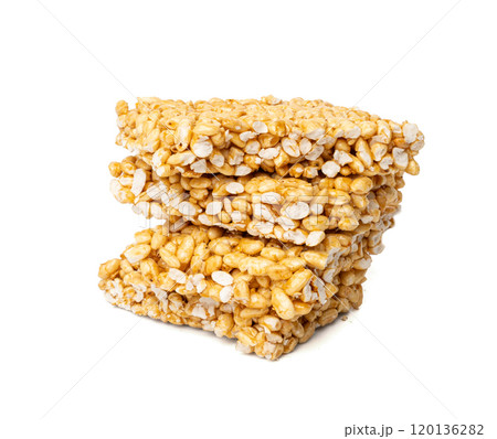 Puffed rice bar isolated, sweet wheat kozinaki, puff cereal block pieces, sugar crispy wheat bar, healthy popped dessert 120136282