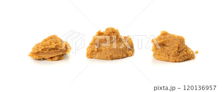 Miso paste isolated. Japanese shiro miso seasoning sauce, fermented soybean spread, brown soy cream Miso paste isolated. Japanese shiro miso seasoning sauce, fermented soybean spread, brown soy cream 120136957