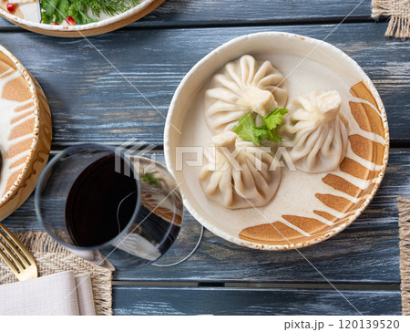 Georgian khinkali, minced meat chinkali, spicy dumplings also called dimsum, momo, jiaozi, manti Georgian khinkali, minced meat chinkali, spicy dumplings also called dimsum, momo, jiaozi, manti 120139520