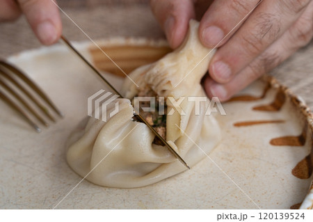 Georgian khinkali, minced meat chinkali, spicy dumplings also called dimsum, momo, jiaozi, manti 120139524