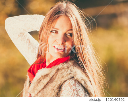 Portrait girl relaxing walking in autumnal park. Portrait girl relaxing walking in autumnal park. 120140592