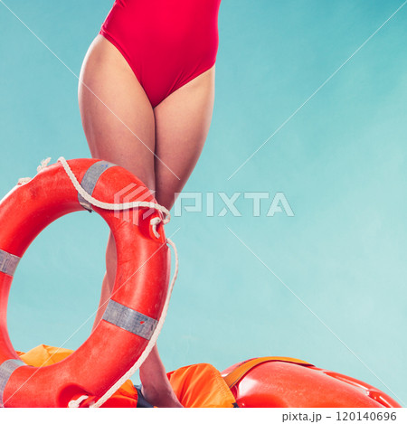 Lifeguard woman on duty with ring buoy lifebuoy. Lifeguard woman on duty with ring buoy lifebuoy. 120140696