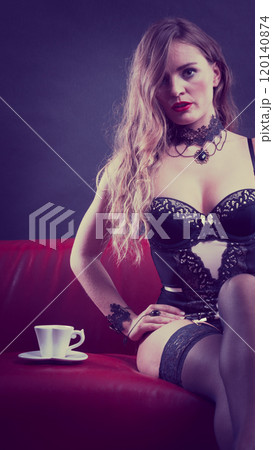 Woman wearing sexy lingerie having coffee cup Woman wearing sexy lingerie having coffee cup 120140874