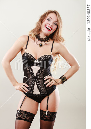 Smiling girl wearing sexy lingerie 120140877