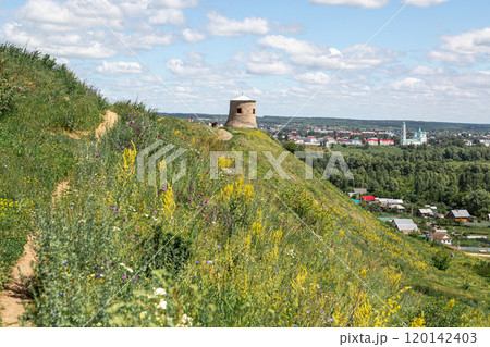 The tower of an ancient Bulgarian fortress on a high cliff on the banks of the Kama River, Elabuga, Tatarstan, Russian Federation 120142403