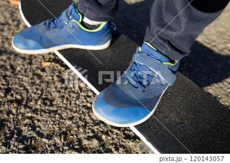 Children's anatomical shoes. A child skates in comfortable barefoot sneakers with a wide toe. Lots of room for the foot Children's anatomical shoes. A child skates in comfortable barefoot sneakers with a wide toe. Lots of room for the foot 120143057