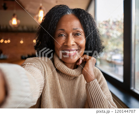 Happy Moments in Coffee Shop Mature Woman Influencer Vlogging or Taking Selfie in Coffee Shop 120144707