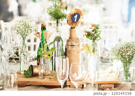 The perfect setting to let love reign supreme. Still life shot of a decorated table setting at a wedding reception. The perfect setting to let love reign supreme. Still life shot of a decorated table setting at a wedding reception. 120145156