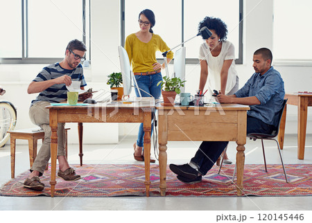 They can design anything. Shot of a group of creative professionals working in an office. 120145446