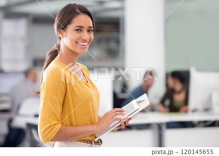 Anything is possible with the help of modern technology. Cropped shot of a businesswoman holding a digital tablet. 120145655