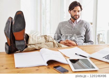 This day is almost over. A handsome businessman relaxing at his desk. 120146496
