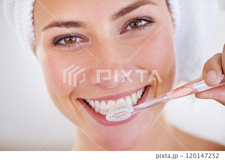 Minty freshness. Portrait of a stunning woman brushing her teeth. Minty freshness. Portrait of a stunning woman brushing her teeth. 120147252