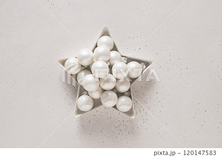 Christmas star with white balls on white background. Creative greeting card. View from above. Alternative Creative Xmas. 120147583