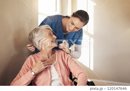 Youre like a guardian angel on my shoulder. Shot of a senior woman in a wheelchair being cared for a nurse. 120147646
