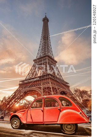 Paris with two symbols the Eiffel Tower and old red car in France 120148027